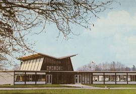 Item is a postcard view of the front exterior of the Calvin B. Hanson Chapel with branches in the upper left foreground.