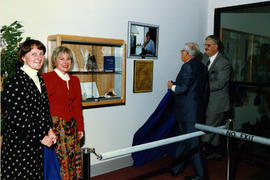 Unveiling the display case and plaque honouring Norma Alloway in Trinity's library.