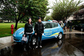 Students from the Global Environmental Issues class with an electric car