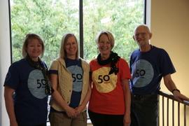 Development staff members wearing 50th anniversary t-shirts