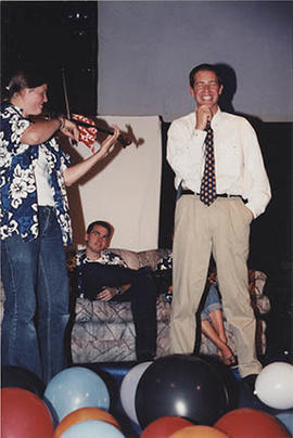 Mike Penninga performing with student leaders in the gym during O-Week