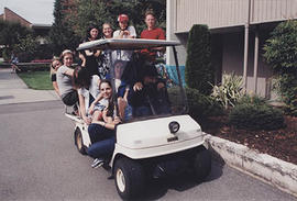 Student leaders piled into a golf cart during O-Week