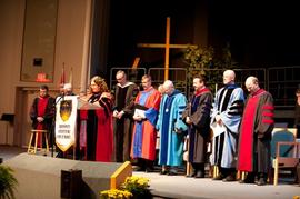 Sara Pearson leading prayer during SGS Graduation