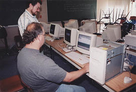 IT staff working on computers in a lab or classroom during O-Week