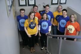 University Communications staff wearing 50th Anniversary t-shirts