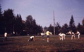 Students playing football on campus.