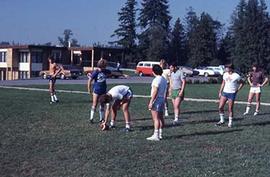 Students playing football on campus.