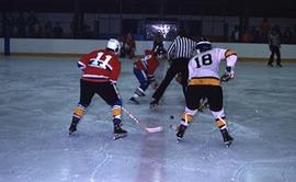 Men's hockey team playing a game.