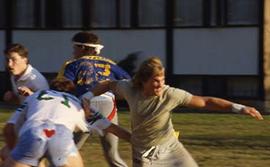 Students playing football on campus.