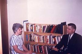 Faculty member Benno Friesen speaks with colleague Ruth Brown.