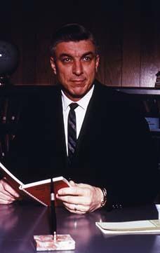 President Calvin Hanson sits in his office.