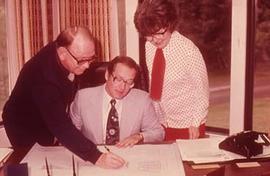 President Neil Snider with staff Eileen Enarson and an unidentified colleague.