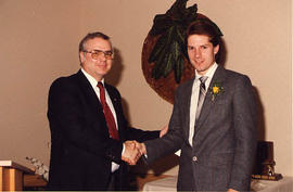 Gary McLeod presenting an award to Darren Johnston