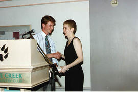 Brad Jacobson presenting an award to an aviation student