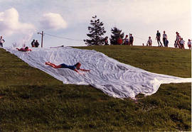 Students water sliding during The Challenge