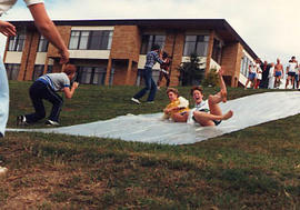 Students water sliding during The Challenge