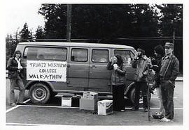 Students standing in front of a van for the walk-a-thon