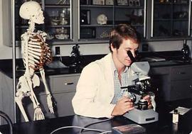 Student looking in a microscope