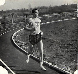 Track and Field Team member running on a track