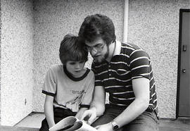 Male student with a child for Outreach