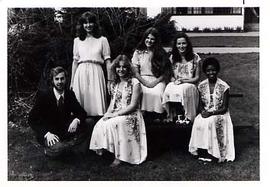 Music group, Aleithia, posing outside on a picnic table