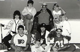 The Sports Committee posing with props