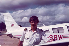 Alumnus Marty Overduin posing with an aircraft