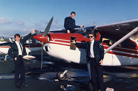 Three students preparing a plane at the Langley Airport