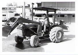 Student driving a tractor during the Work-a-thon