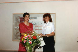 Jeanette Blaker presenting an award to an aviation student