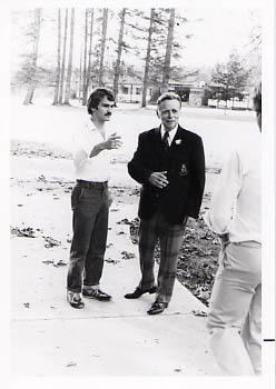 Robert N. Thompson talking with a student