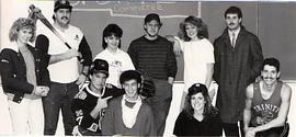 The Sports Committee posing with props