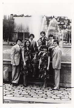 Music group, Selah, posing outside in front of a fountain