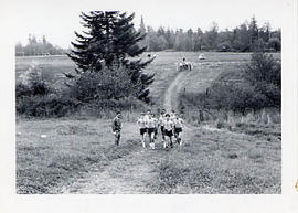 TJC Track team running in a field