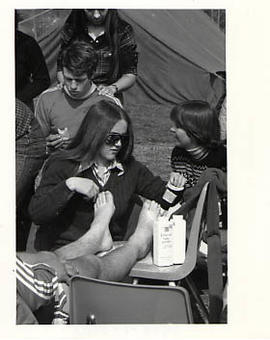 Student providing foot care during the Soccer Marathon