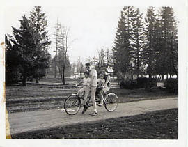 Two students with children riding tandem