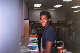 Student library assistant working in the library