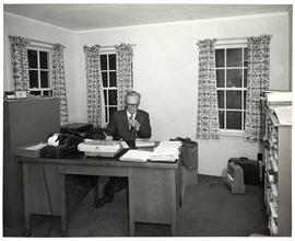 Registrar Enoch E. Mattson at his desk