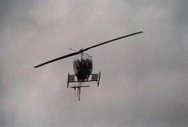 Dr. Neil Snider arriving in a helicopter