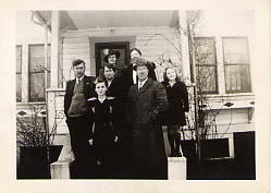 The Odland family posing in front of their house