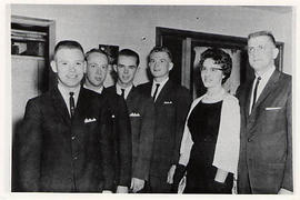 Music ensemble posing with faculty