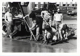 Students spreading cement during the Work-a-thon