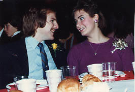 Students seated at a table during a Christmas Banquet