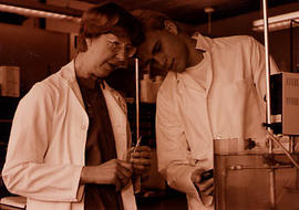 Faculty working with a student in the lab