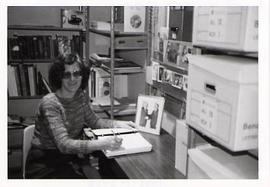 A contract archivist at her desk