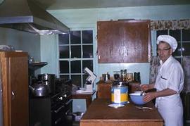 Mr. Jenstad preparing food in the kitchen.