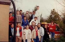 Student workers and Library staff posing with a tow truck