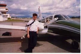 Greg Brown posing with an airplane