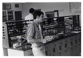 Student standing in a chemistry lab