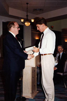 Rob Rausch receiving an award